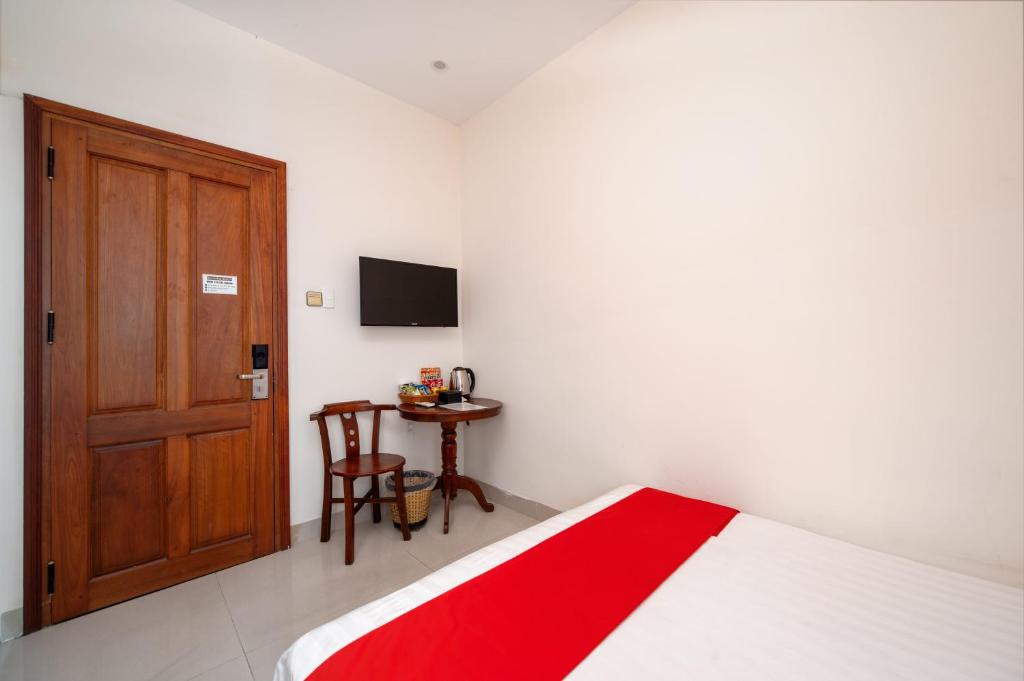 Postel nebo postele na pokoji v ubytování Sunshine Beach Da Nang