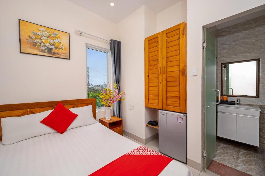 Postel nebo postele na pokoji v ubytování Sunshine Beach Da Nang