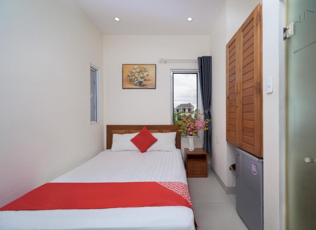 Postel nebo postele na pokoji v ubytování Sunshine Beach Da Nang