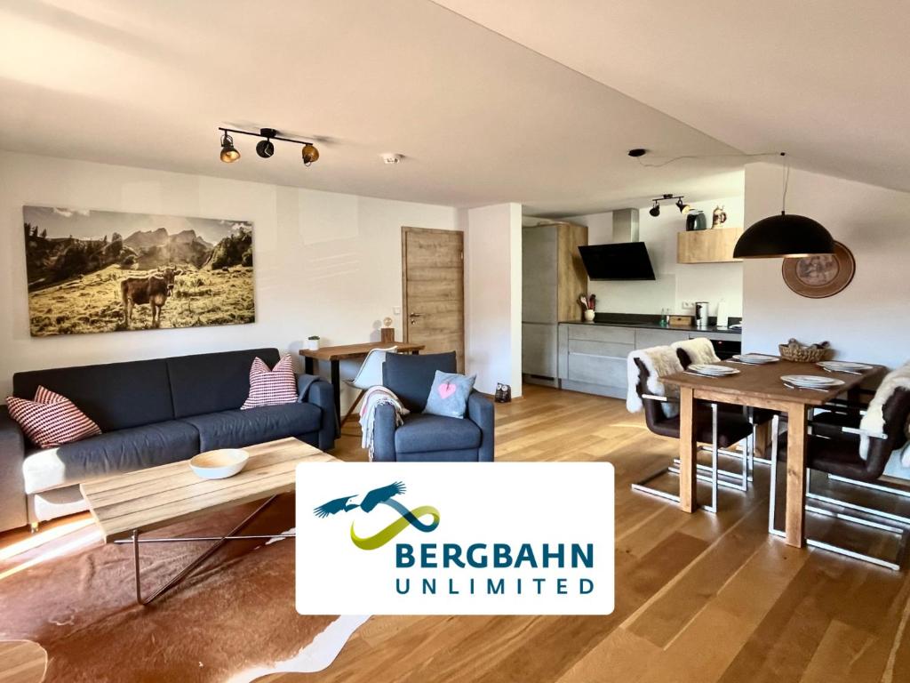 a living room with a couch and a table at BERGFEX Jägersberg mit Sommer-Bergbahnticket in Oberstdorf