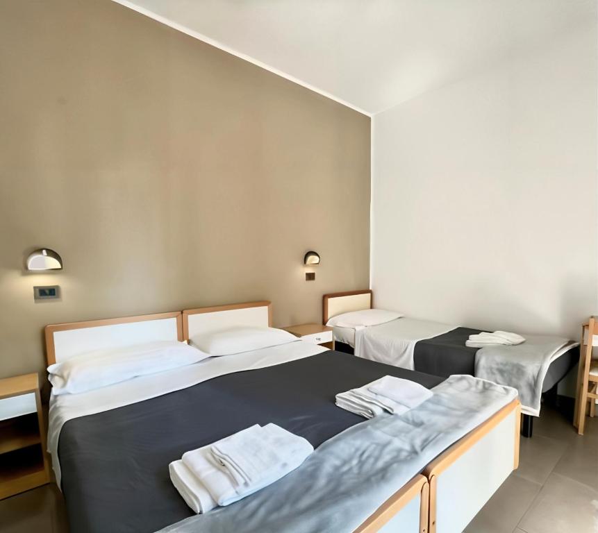 Postel nebo postele na pokoji v ubytování Hotel Quisisana