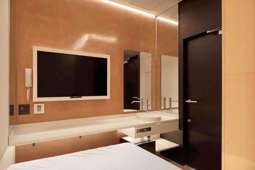 Postel nebo postele na pokoji v ubytování hotel min 大人専用
