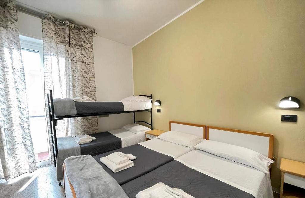 Postel nebo postele na pokoji v ubytování Hotel Quisisana