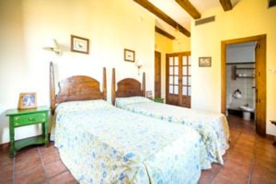 Postel nebo postele na pokoji v ubytování La Hostería de Oropesa