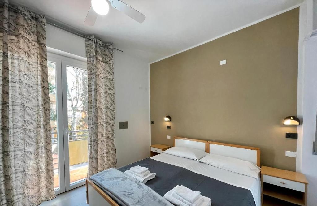 Postel nebo postele na pokoji v ubytování Hotel Quisisana