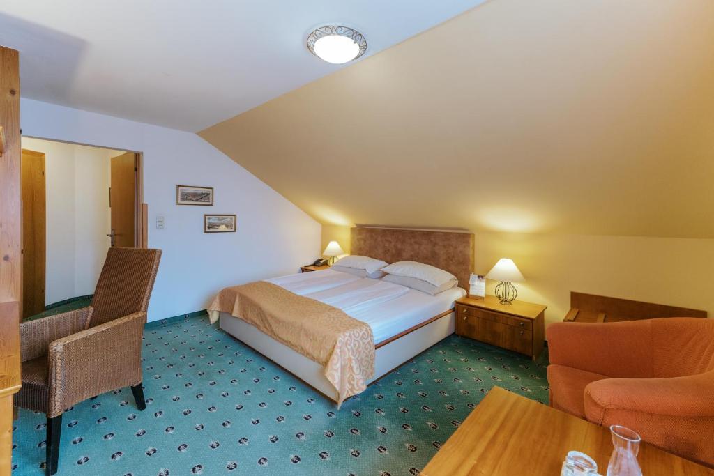 Postel nebo postele na pokoji v ubytování Garten-Hotel Ochensberger