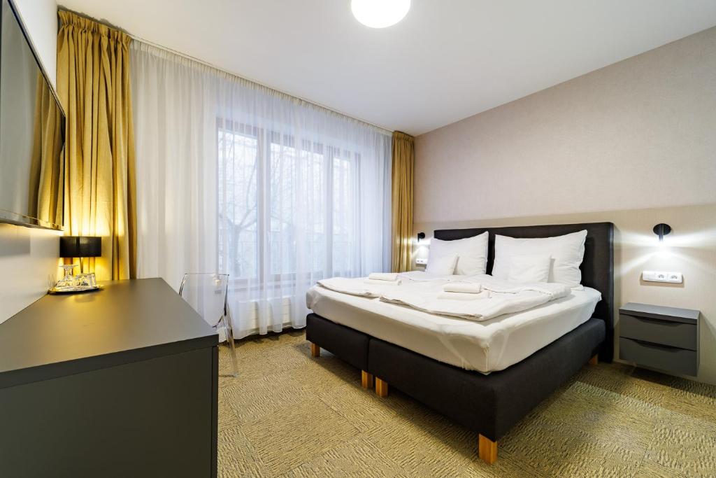 Postel nebo postele na pokoji v ubytování Penzion Pod Kartouzkou