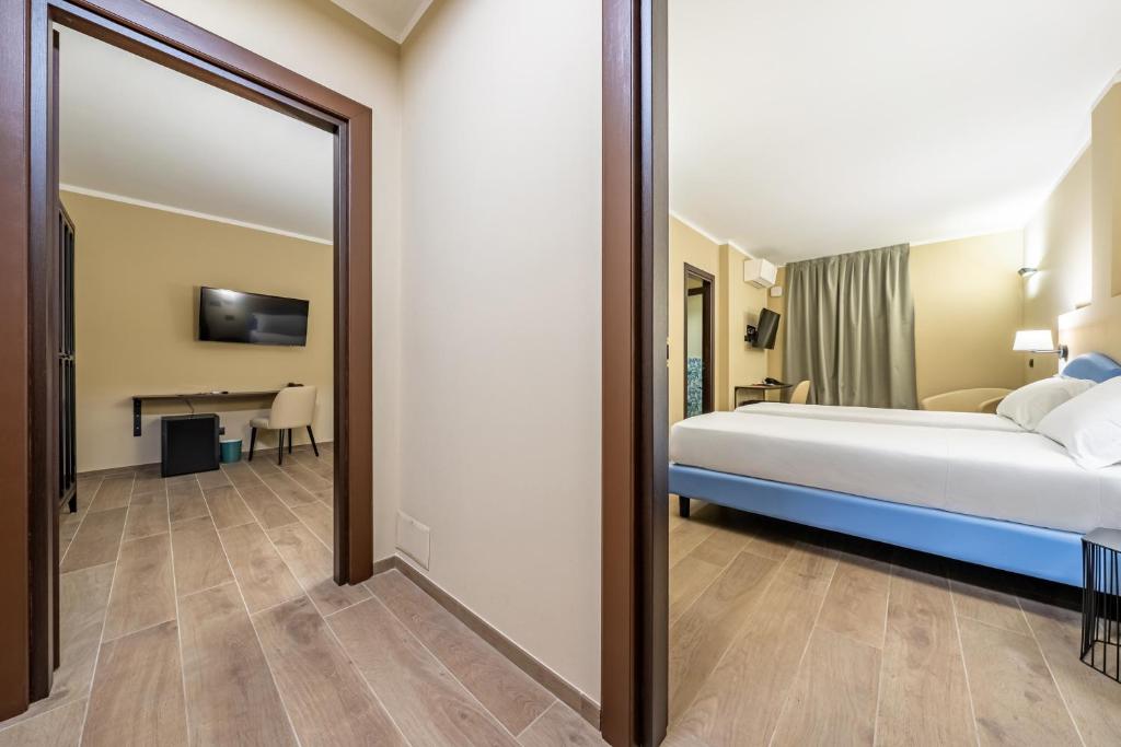 Postel nebo postele na pokoji v ubytování Motel Hotel Charlie