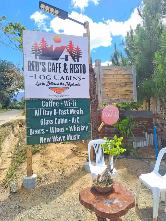 a sign for a cafe and rips cafe and rescue ice carts at Red's Cafè & Resto- Glass Cabin in Manolo Fortich