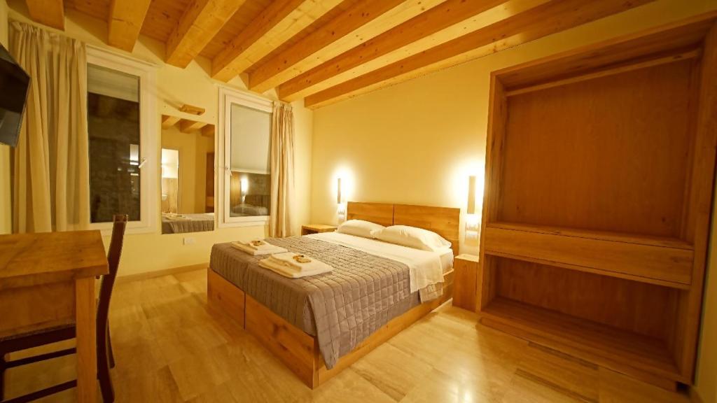 Postel nebo postele na pokoji v ubytování Destiny Home & rooms Soave
