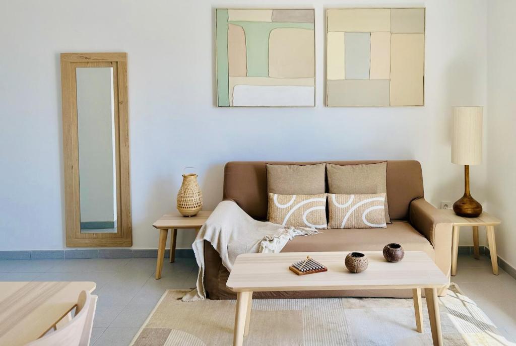 a living room with a couch and a table at Canaryislandshost I Dalia in Puerto del Carmen
