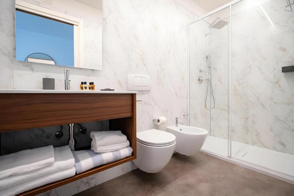 Koupelna v ubytování HOTIDAY Room Collection - Grado