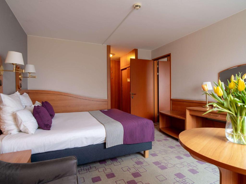 Posteľ alebo postele v izbe v ubytovaní Mercure Cieszyn