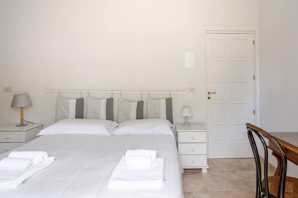 Postel nebo postele na pokoji v ubytování Villa Vittoria B&B