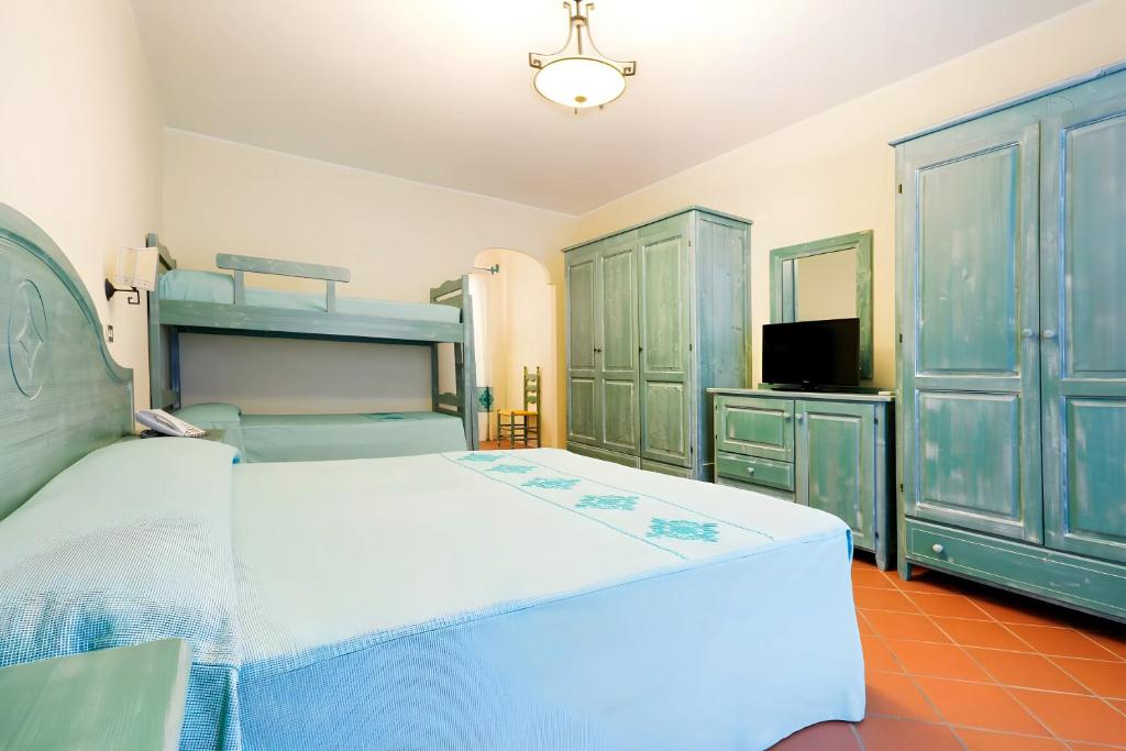 Postel nebo postele na pokoji v ubytování HOTIDAY Room Collection - Golfo Aranci