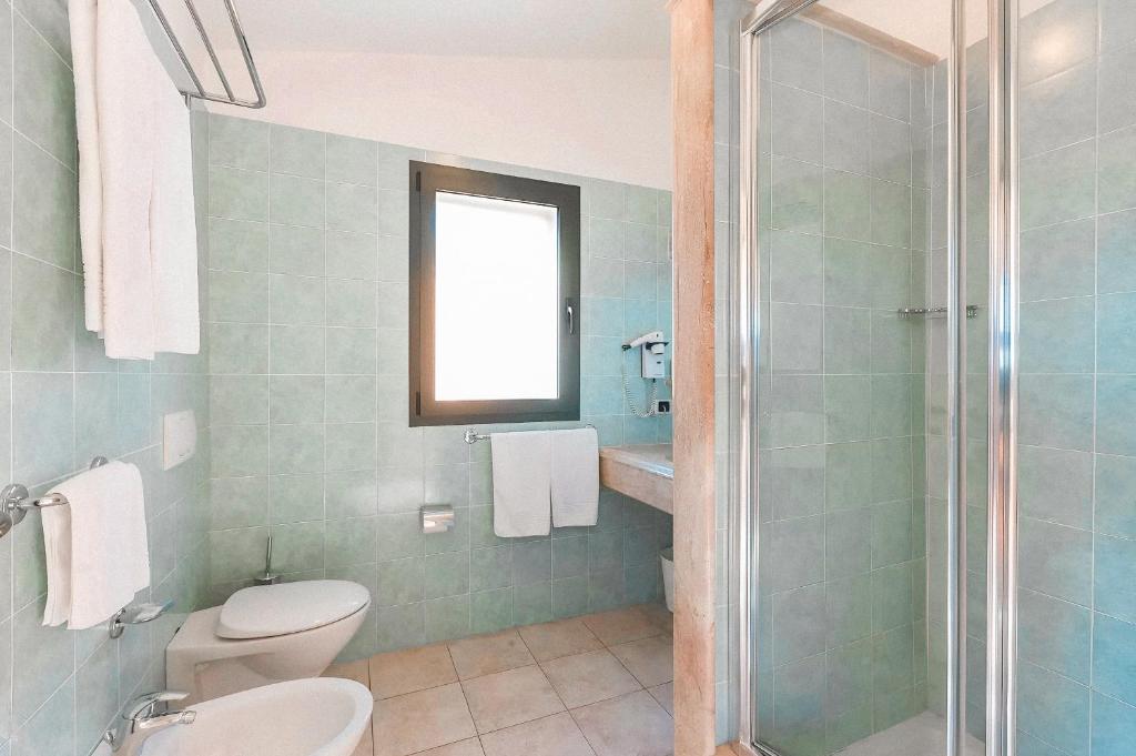 Koupelna v ubytování HOTIDAY Room Collection - Golfo Aranci