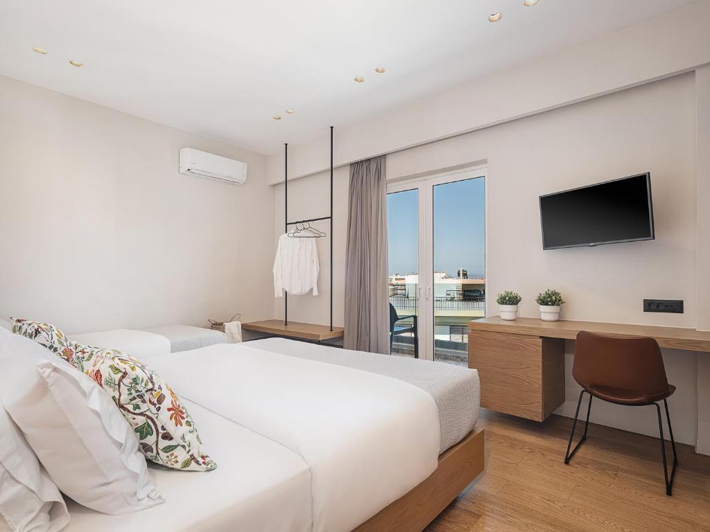 Postel nebo postele na pokoji v ubytování Theofilos City Hotel