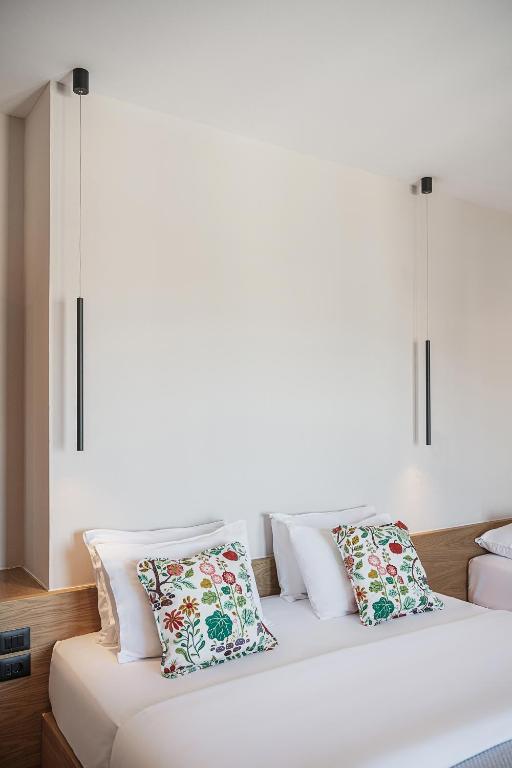 Postel nebo postele na pokoji v ubytování Theofilos City Hotel