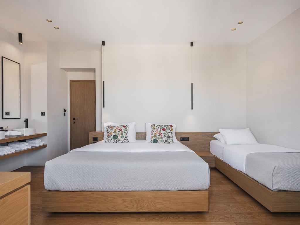 Postel nebo postele na pokoji v ubytování Theofilos City Hotel