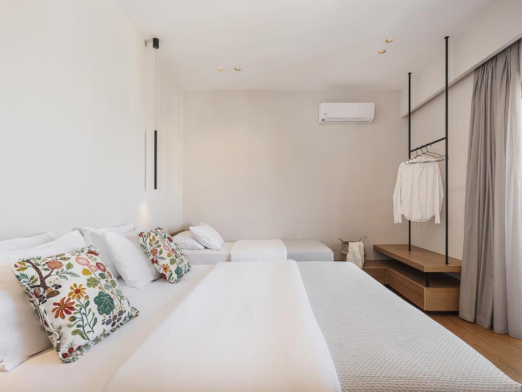 Postel nebo postele na pokoji v ubytování Theofilos City Hotel
