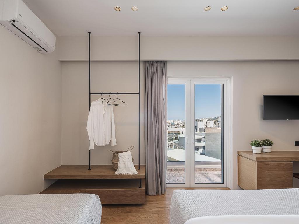 Postel nebo postele na pokoji v ubytování Theofilos City Hotel