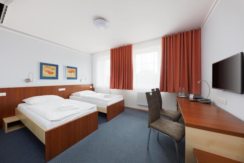 Postel nebo postele na pokoji v ubytování Hotel Nikolas