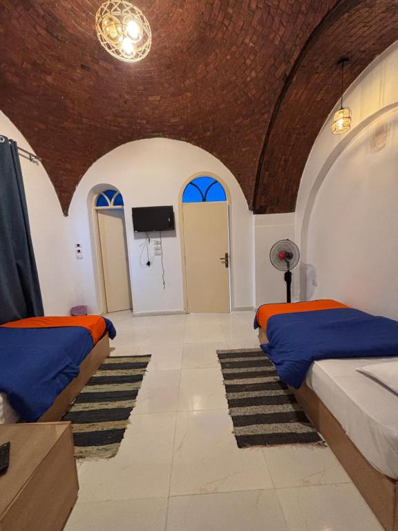 Postel nebo postele na pokoji v ubytování JAREEDY Guest house
