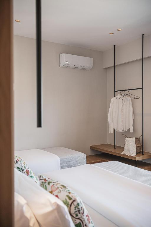 Postel nebo postele na pokoji v ubytování Theofilos City Hotel