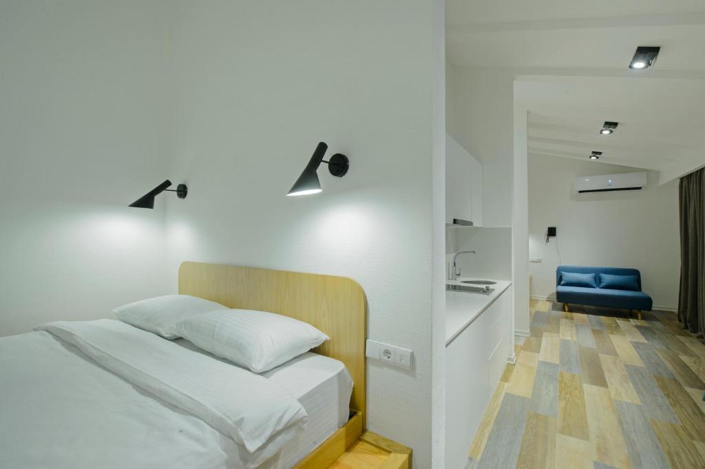 Postel nebo postele na pokoji v ubytování Mariinsky Boutique Hotel