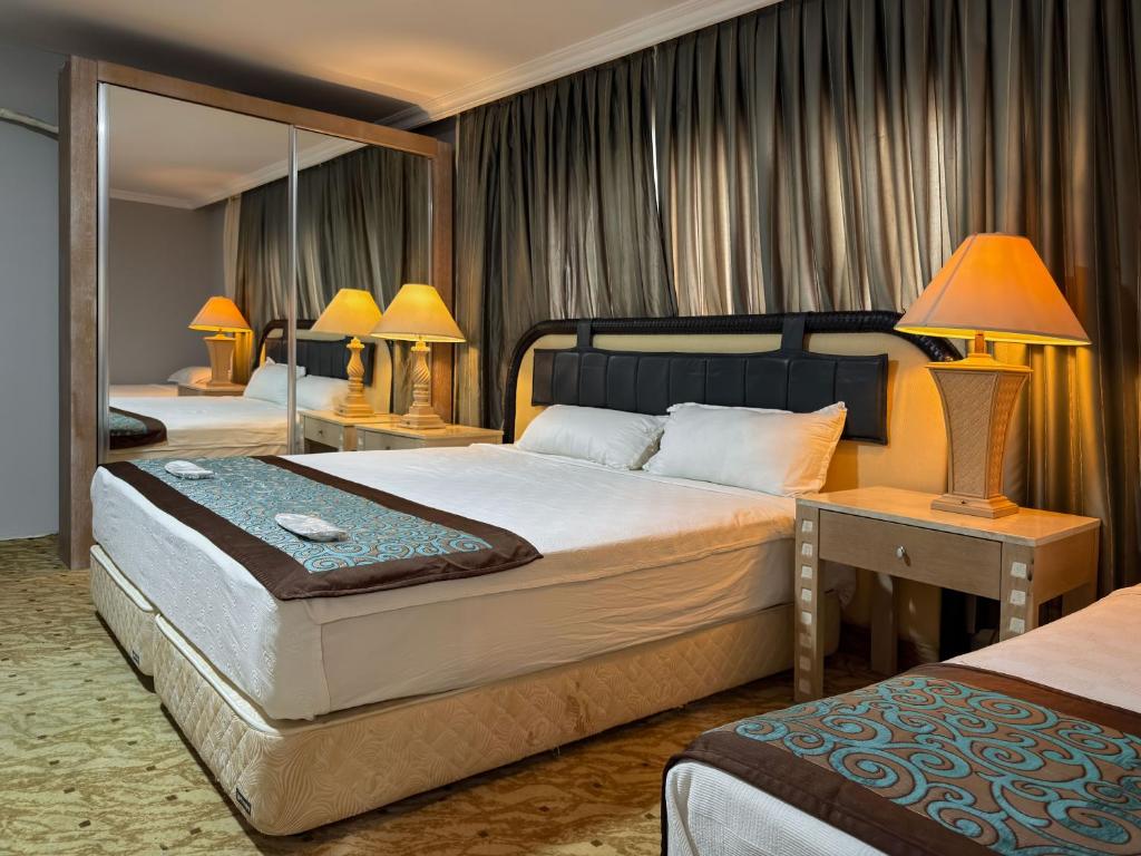 Ένα ή περισσότερα κρεβάτια σε δωμάτιο στο SEVER SUİTES HOTEL