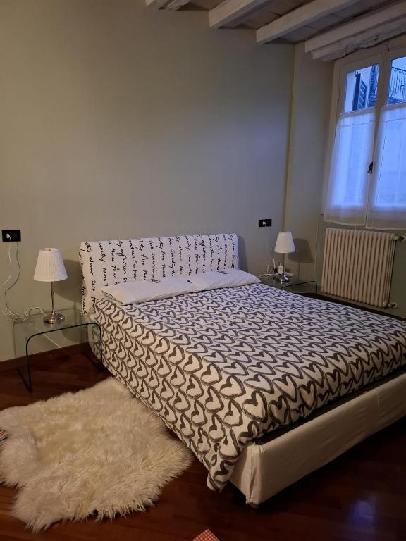 Una cama o camas en una habitación de Carducci