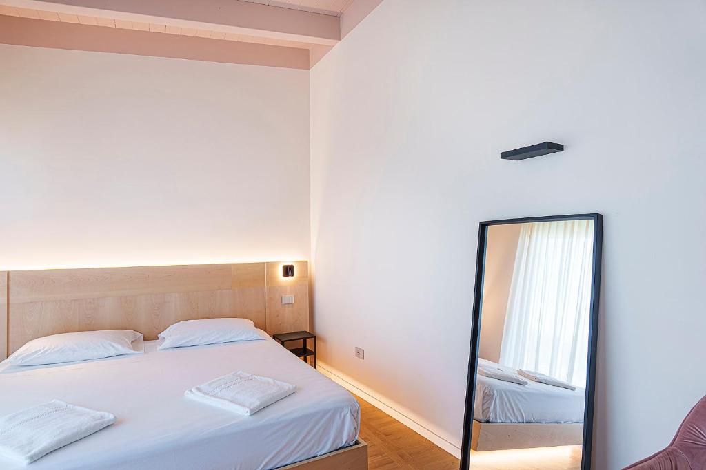 Postel nebo postele na pokoji v ubytování Uefio - Luxury Suites