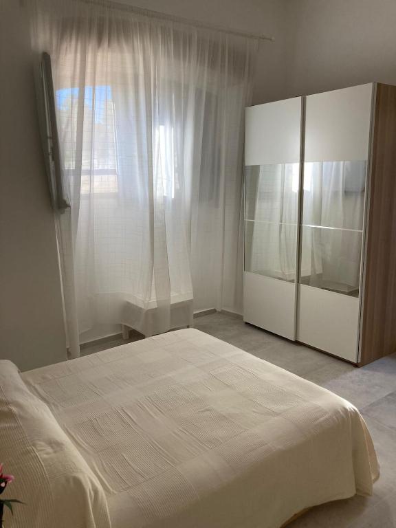 Postel nebo postele na pokoji v ubytování La Riccia Guest House