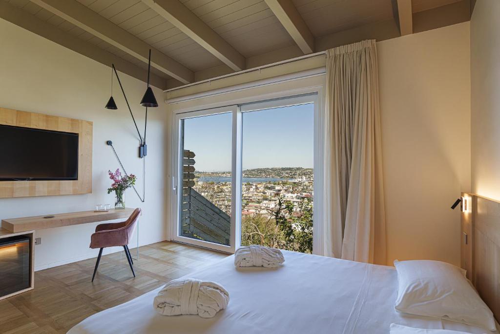 Postel nebo postele na pokoji v ubytování Uefio - Luxury Suites