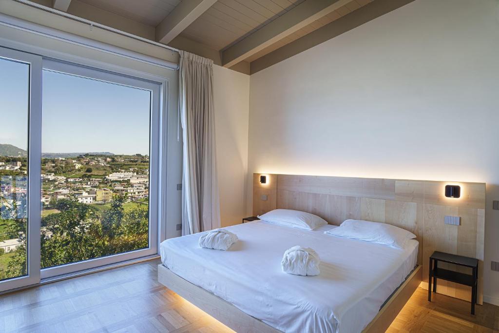 Postel nebo postele na pokoji v ubytování Uefio - Luxury Suites