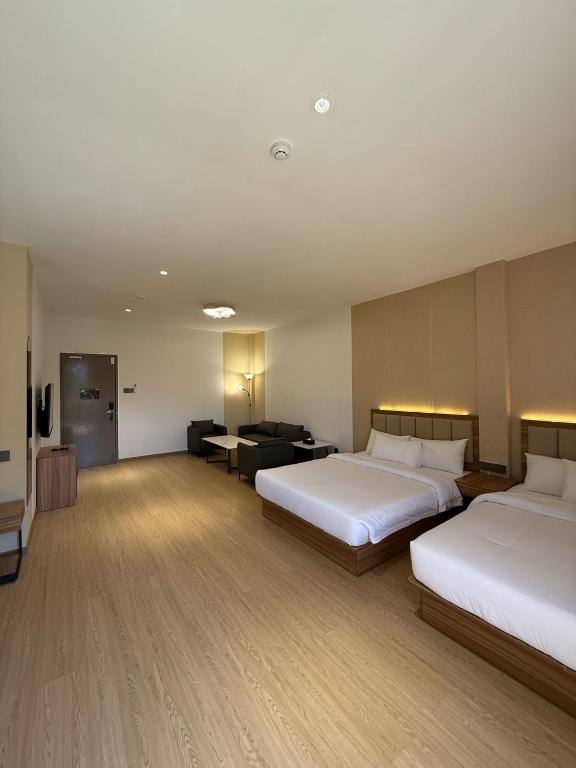 Postel nebo postele na pokoji v ubytování Hotel Ivory Papar