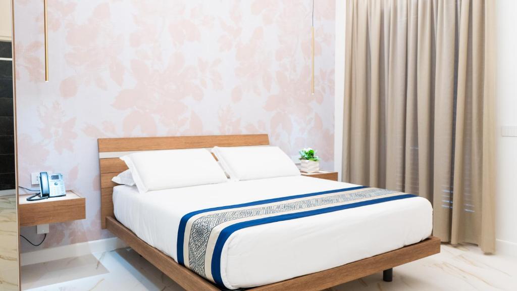 Postel nebo postele na pokoji v ubytování Hotel Diana