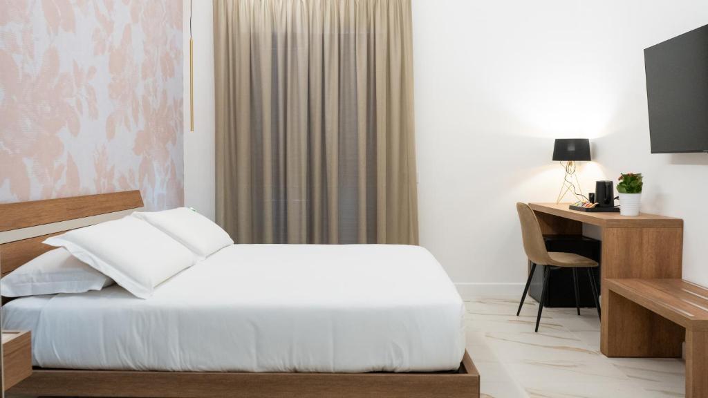 Postel nebo postele na pokoji v ubytování Hotel Diana