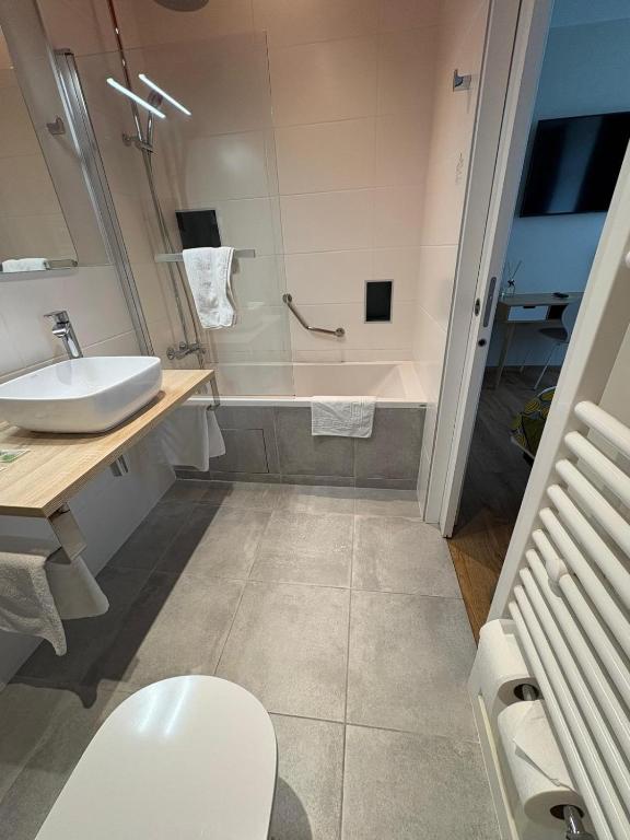 Koupelna v ubytování Hôtel Moderna