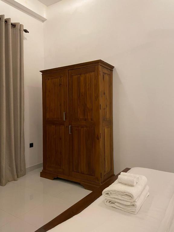 Postel nebo postele na pokoji v ubytování Mount Airy Aniwatta