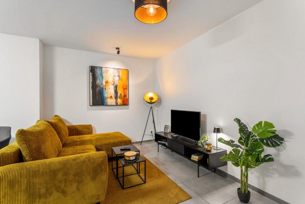 TV a/nebo společenská místnost v ubytování Tua Casa - Souterrain Appartment