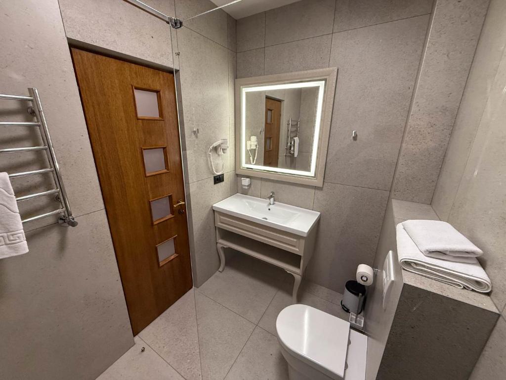 Koupelna v ubytování Komilfo Hotel