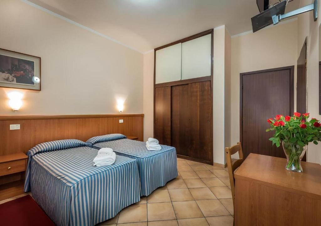 Postel nebo postele na pokoji v ubytování Hotel Real
