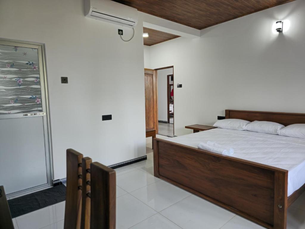 Postel nebo postele na pokoji v ubytování Lion See Hotel - Sigiriya