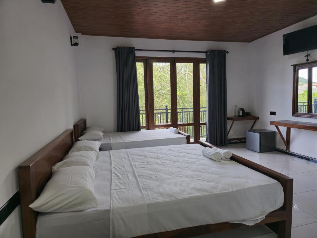 Postel nebo postele na pokoji v ubytování Lion See Hotel - Sigiriya