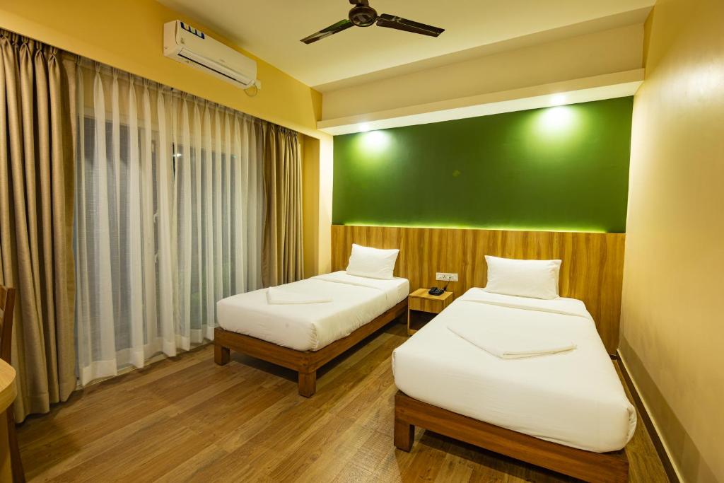 Katil atau katil-katil dalam bilik di Hotel Quest