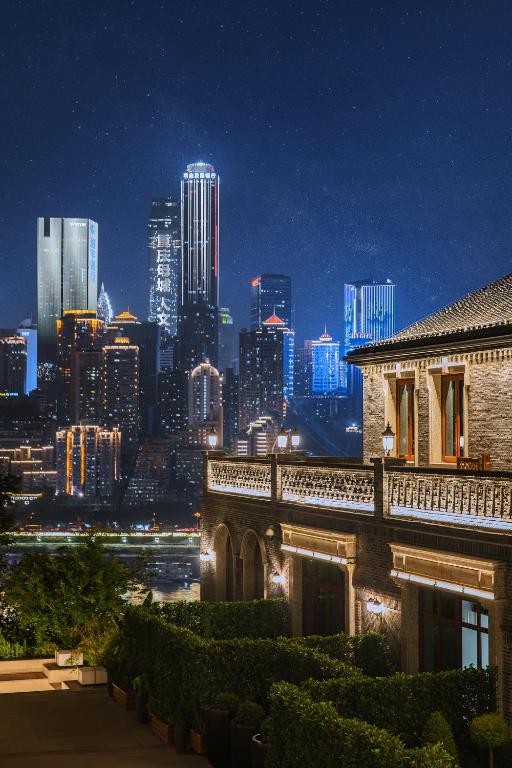 a view of a city skyline at night at Chongqing Manque Mansion, Century Old Republic Style & River View, Free Custom Photoshoot, Free Breakfast & 131 Skydeck Ticket in Chongqing