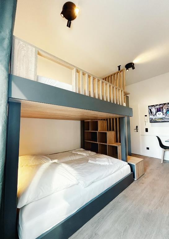 Postel nebo postele na pokoji v ubytování Homaris Apartments Winterhude