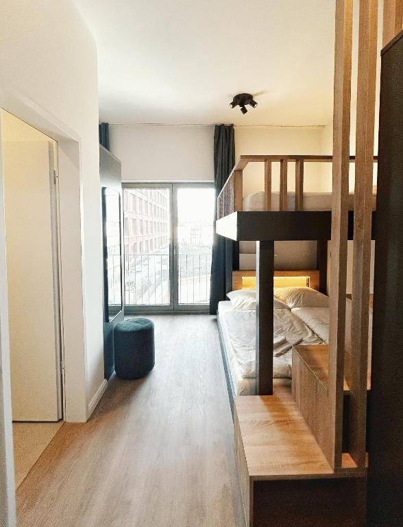 Postel nebo postele na pokoji v ubytování Homaris Apartments Winterhude