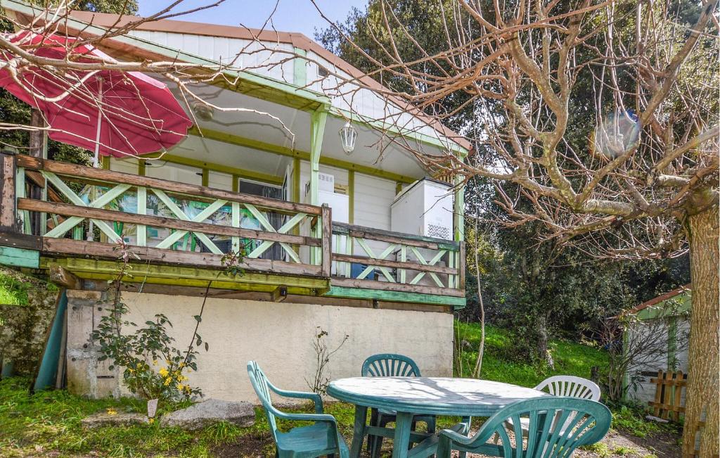 a table and chairs in front of a house at Gorgeous Stacaravan In Casalabriva in Casalabriva